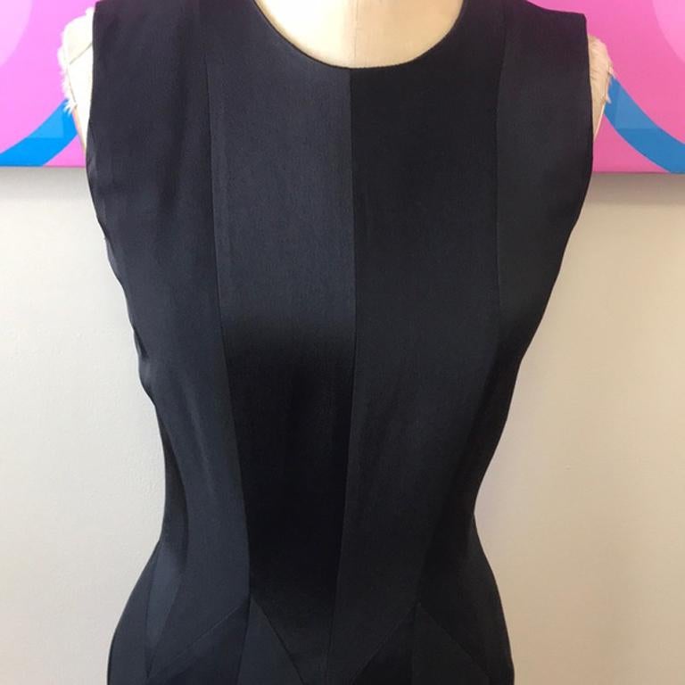 Moschino cheap chic black satin panel dress

The little black dress gets a retro update with this vintage piece by Moschino Cheap and Chic. Just add pearls, heels and you!

Brand runs small
Size 4
Across chest - 16.5 inches
Across waist - 13