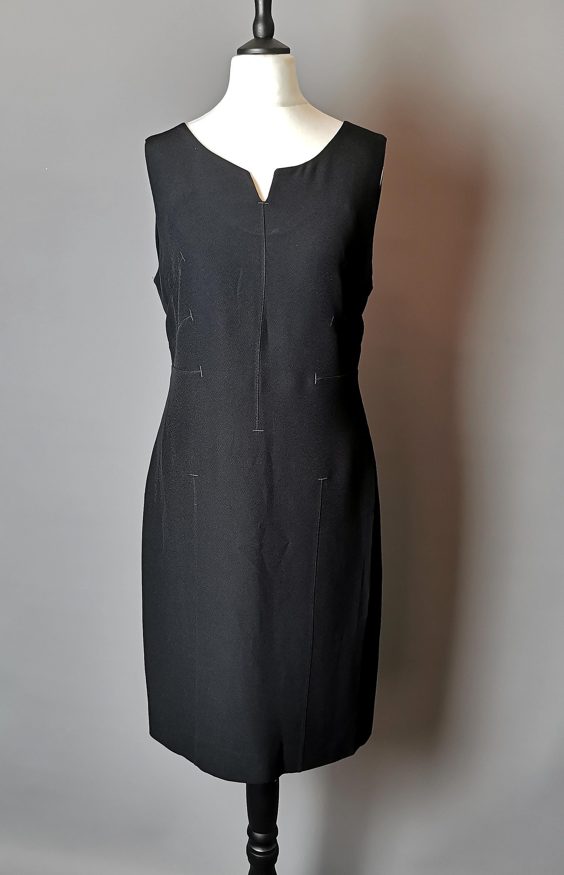 A gorgeous vintage c2000s Moschino Cheap and Chic sheath dress.

It has a simple sheath silhouette with stitch detailing to the body and bust, this gives the dress an interesting twist.

Perfect for the office it day to night wear, easily dressed up
