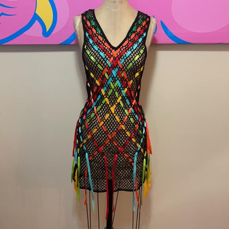 Moschino cheap and chic black woven ribbon dress

Be retro cool wearing this vintage open weave knit dress with ribbon weaving. From the 1980s. Vintage perfection. It needs something underneath....perhaps a classic black slip or colorful