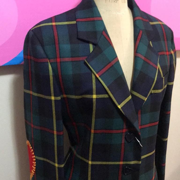 Moschino cheap chic green red plaid wool jacket

An extraordinary find is new w/ tags vintage Moschino ! As wearable today as when it was made - pair w/ navy blue skinny pants & a red or white blouse for a great look. Heart shaped elbow patches.