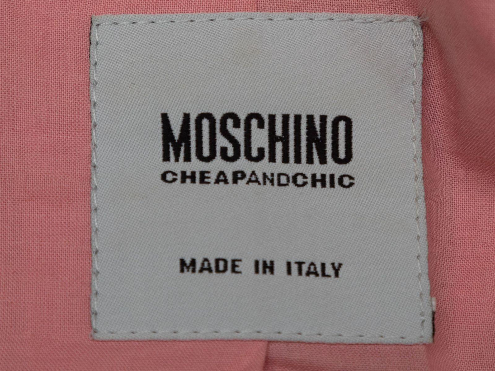 Product Details: Light pink fringe-trimmed blazer by Moschino Cheap and Chic. Notched lapel. Dual hip pockets. Button closures at front. 34