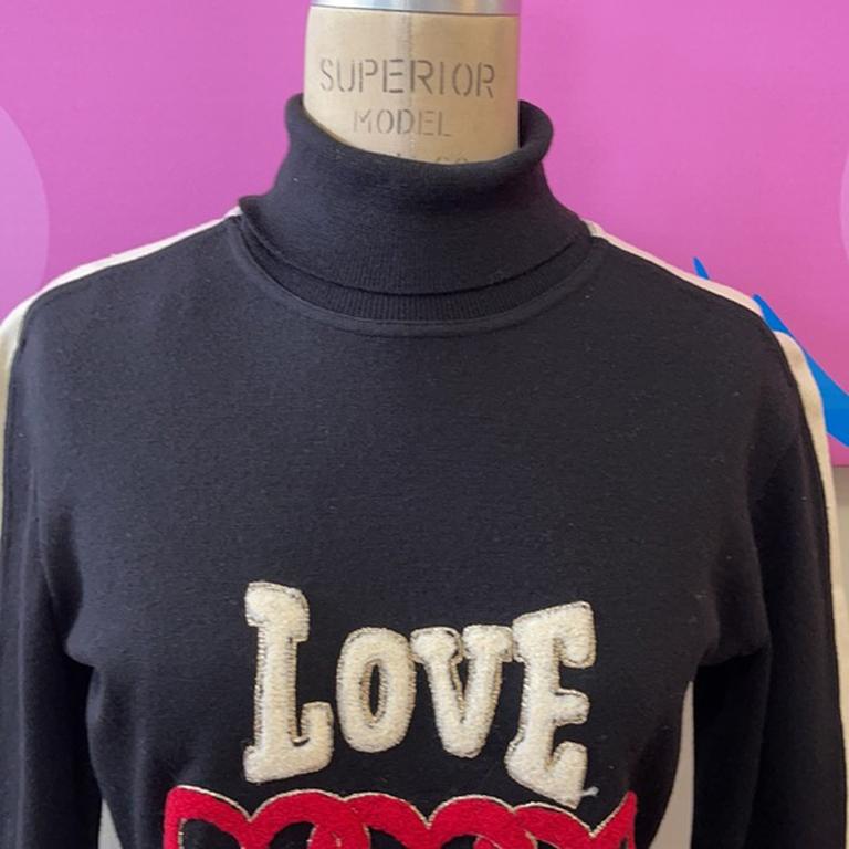 Moschino cheap and chic love champion sweater

Moschino makes Fall dressing shine with unique pieces like this sweater with letterman style letters on the front! Pair with black skinny pants and boots for a complete look. Rare. Iconic. Slight