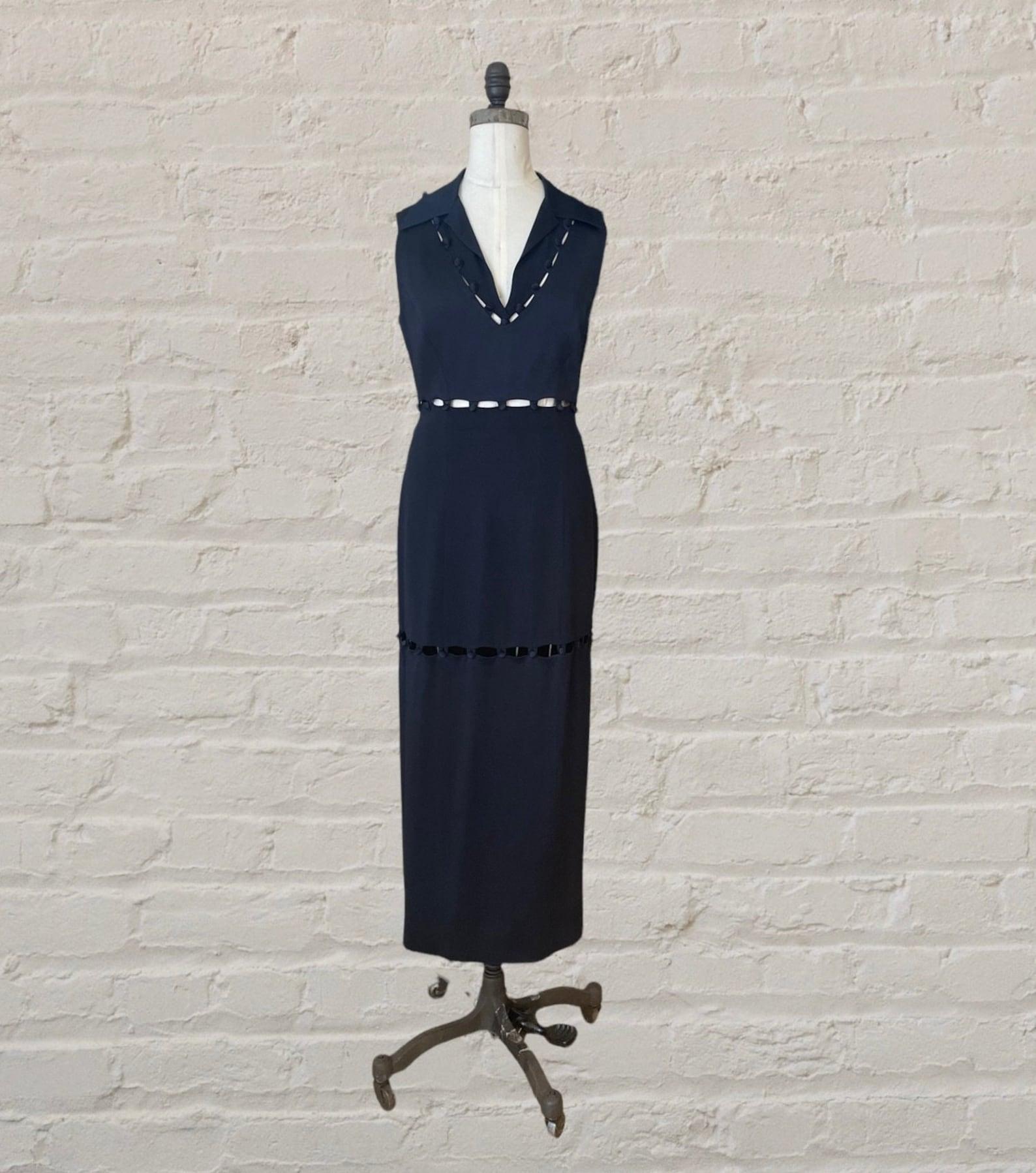Moschino Cheap and Chic midnight blue ankle length dress. Straight sheath silhouette, winged collar, deep v neck, sleeveless. Peekaboo cut outs at bodice, back, waist and along the skirt. Button details are functional, top & skirt are fully