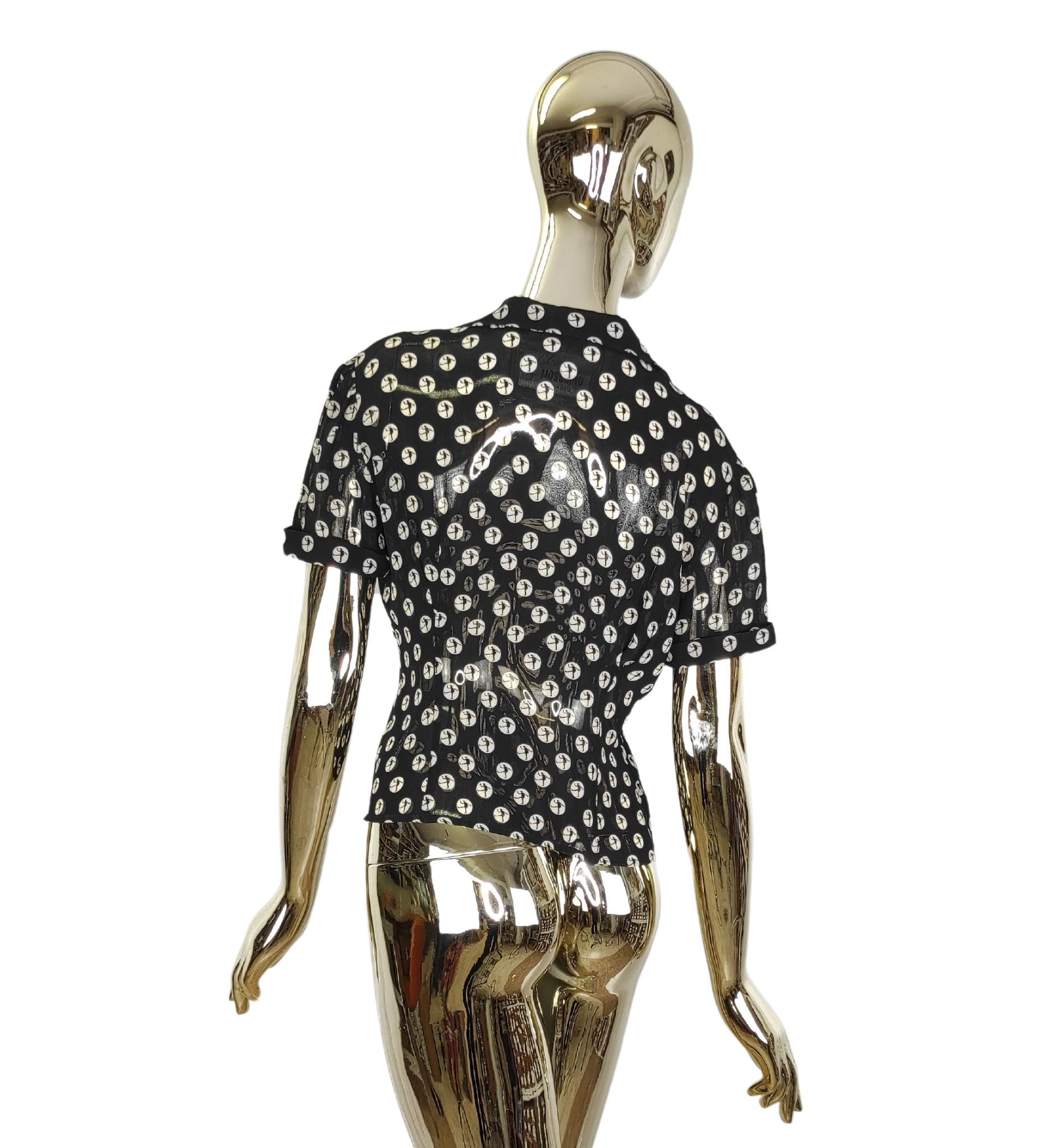 Moschino Cheap and Chic blouse
White print on black background
Front bow
Printed buttons

Marked size 44 IT
Measurements
shoulders 43 cm - 17 in
bust 101,5 cm - 40 in
waist 78,5 cm - 31 in
hips 91,5 cm - 36 in
length 51 cm - 20 in

Good