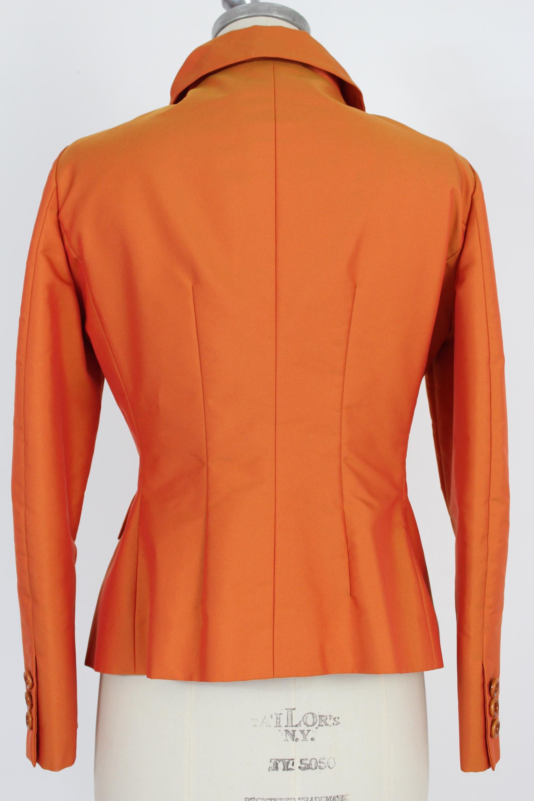 Moschino Cheap and Chic 90s vintage women's jacket. Fitted model, knots on the reverse, pockets on the sides. Orange color, 100% polyester. Internally lined. Made in Italy. Excellent vintage condition.

Size: 46 It 12 Us 14 Uk



Shoulder: 46