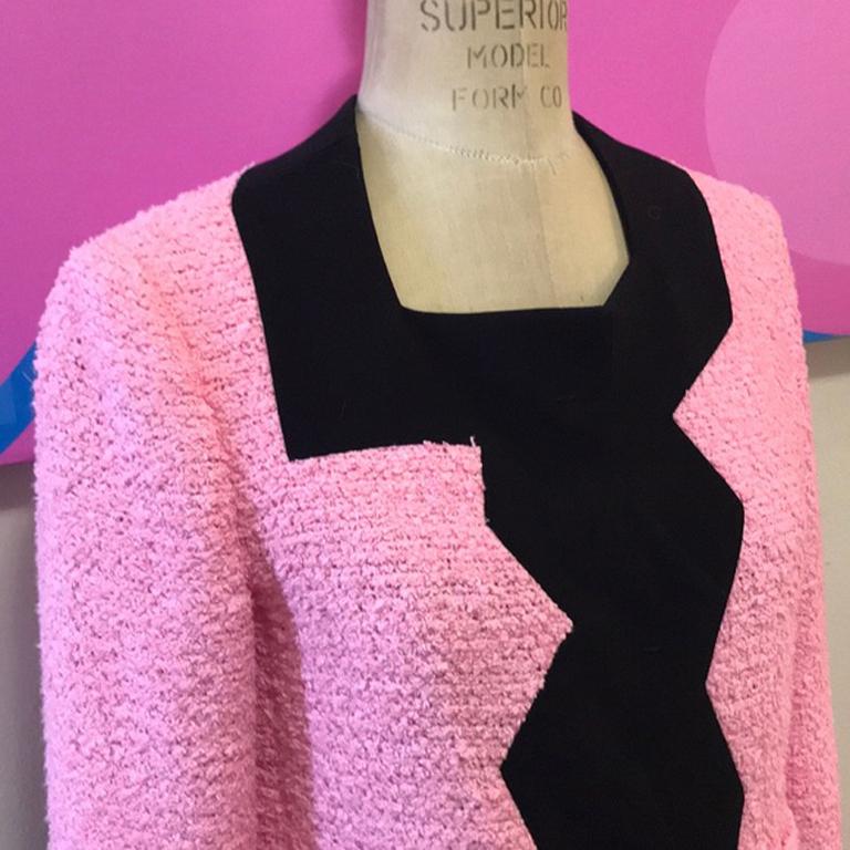 Moschino cheap and chic pink black boxy

Be retro cool wearing this vintage jacket by Moschino ! 3/4 sleeves and jagged edges make this a stand out. Dress up with black wool pants or skirt or dress down with skinny jeans !

Size 6
Across chest - 18