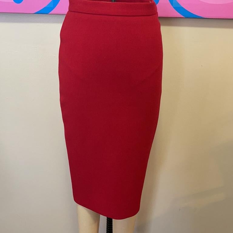 Moschino red wool pencil skirt

Fall dressing shines wearing this Moschino skirt of a pop of red with a black turtleneck sweater tights and boots! 
Size 4.

Across waist - 13.5 in.
Across hips - 17 in.
Length - 24.5 in.
Material: 
100% Wool
Lining -