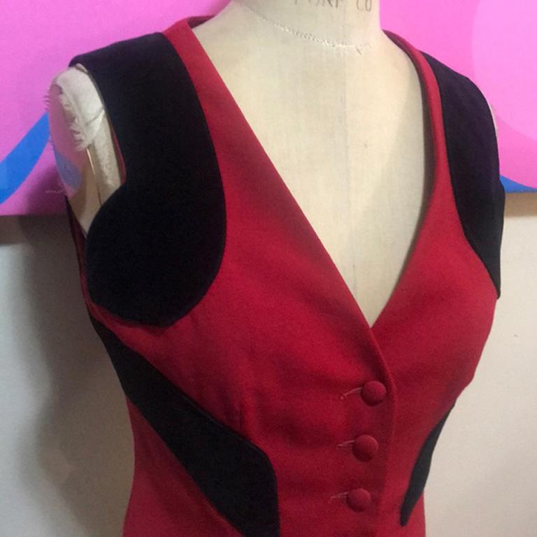 Moschino cheap n chic red wool question mark vest

Vintage wonder ! This iconic wool vest by Moschino with black velvet question marks around the shoulder a wear over crisp white shirt with black skinny pants and boots for a great look. Brand runs