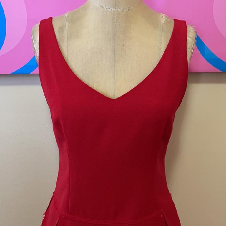 Moschino cheap and chic red wool scalloped dress

Party in retro cool style in this scalloped bottom dress by Moschino Cheap and Chic! Who can resist a woman in red? 
Brand runs very small.   Please check measurements to ensure fit.

Size 8

Across