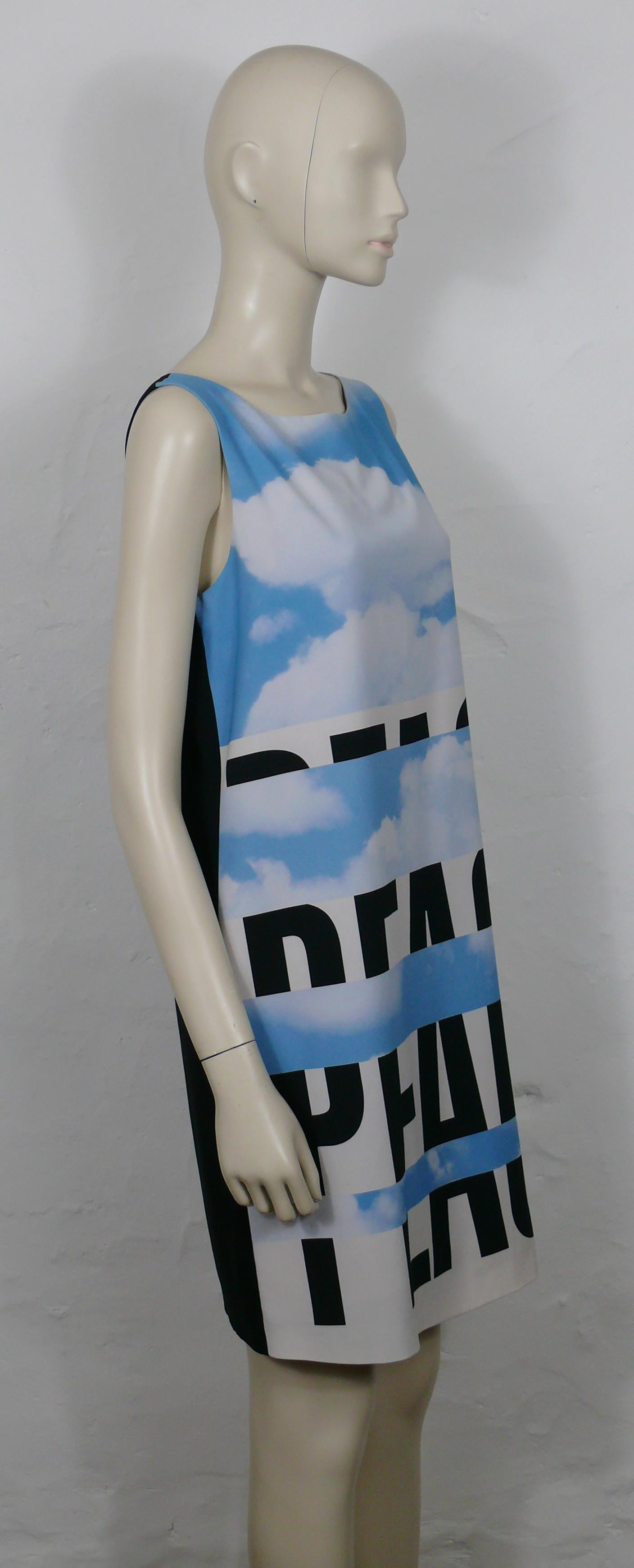 MOSCHINO Cheap and Chic sky blue cloud peace dress.

This dress features :
- A cloudy sky print with block PEACE lettering.
- Back black panel.
- Sleeveless.
- Fully lined.
- Hidden zippered back closure.

Label reads MOSCHINO CHEAP AND CHIC.
Made