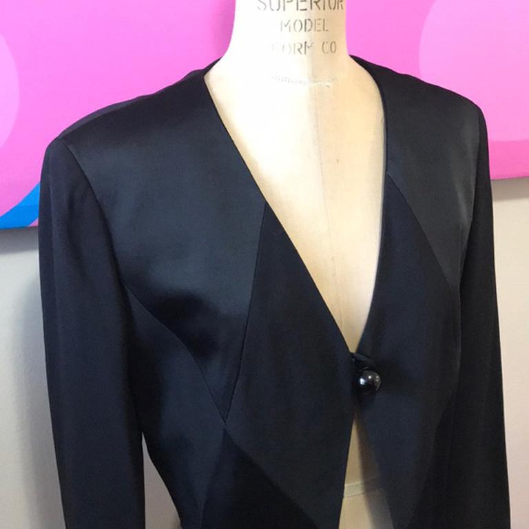 Moschino cheap chic back tuxedo jacket

Unique vintage jacket from Moschino with black on black Harlequin satin panels and tassels in the front are a unique tuxedo style! Pair with simple black pants and heels for a nice tuxedo style look. 
Size