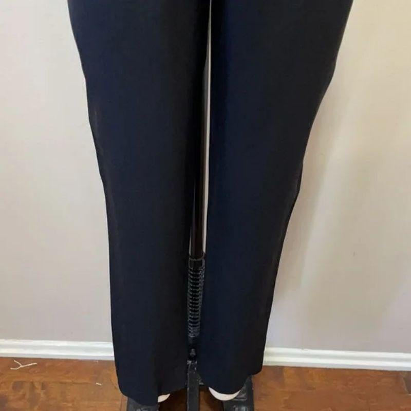Moschino cheap chic black high waist pants

Be retro cool wearing these vintage high waist pants by Moschino Cheap and Chic! Ankle length and a bit of a peg leg. Cute plastic heart button at the waist - this is your clue to this being from the