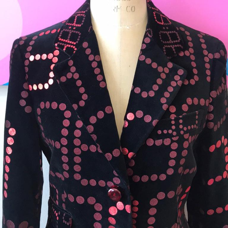 Moschino cheap chic black orange velvet blazer

This vintage black velvet blazer with orange digital numbers is museum worthy! Pristine condition. Perfect for evening events paired with black pencil pants and boots.
Size 8
Across the chest - 18 1/2