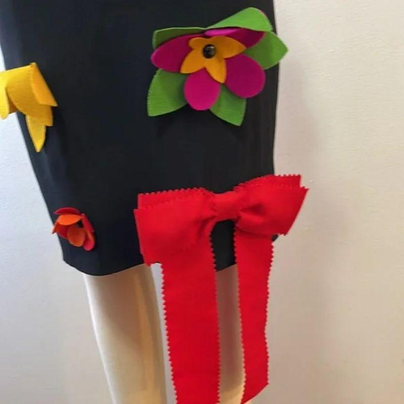 Moschino cheap chic black pencil skirt flower bow applique

Moschino Cheap and Chic line creates a timeless and fun design with this applique black pencil skirt! Pair with black turtleneck sweater and heels for a finished look. NOTE: the flower