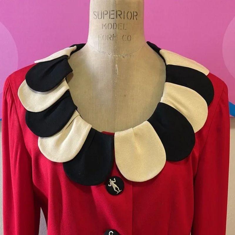 Moschino cheap chic black red white flower petal jacket blazer

Be retro cool wearing this vintage blazer with a flower pedal design. Pair with black pants and ankle boots for a finished look. Olive Oyl featured on button.  Brand runs small please