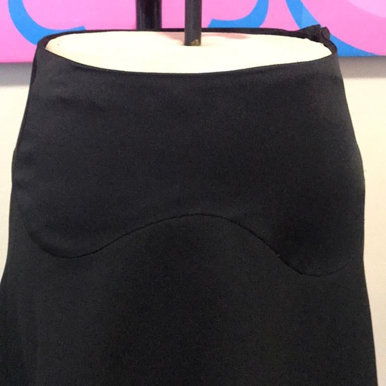 Moschino cheap chic black satin tuxedo skirt

This mini skirt has a nice flare to it with a tuxedo style and satin panels. Side zipper. Brand runs very small! Matchings jacket also for sale. Vintage glamour! Brand runs small please check