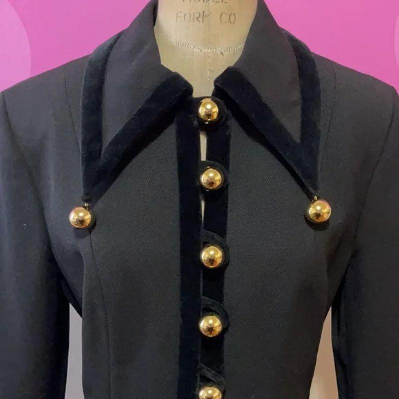 Moschino cheap chic black vintage blazer gold ball buttons

Be retro hip wearing this unique vintage style blazer from the 1980s / 1990s by Moschino. As wearable today as when it was made. A very harlequin style jacket. Pair with black skinny pants