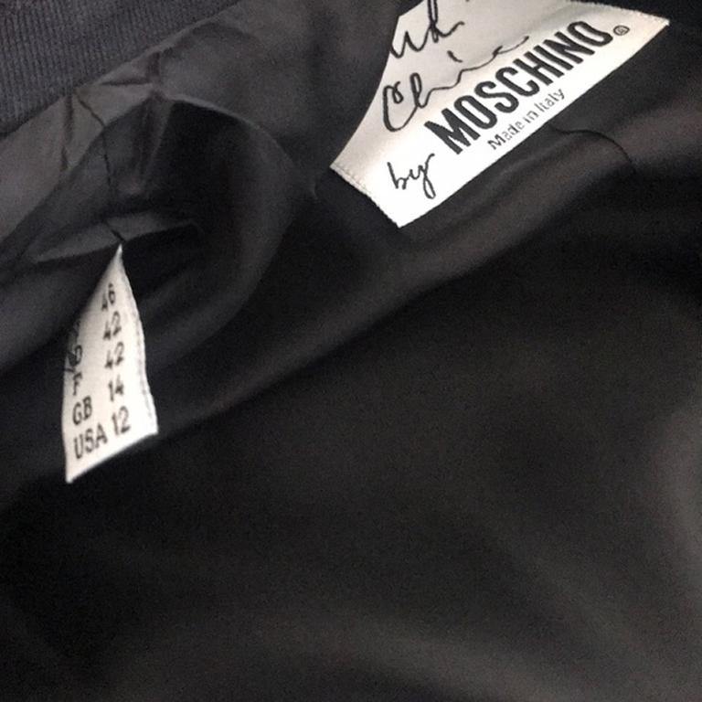 Moschino cheap chic black white blazer 

Museum worth Moschino blazer with enamel buttons and unique words on white ribbon around. Seen at the MINT MUSEUM EXHIBIT. Brand runs very small. We are also selling matching skirt.

Across chest - 19 1/2