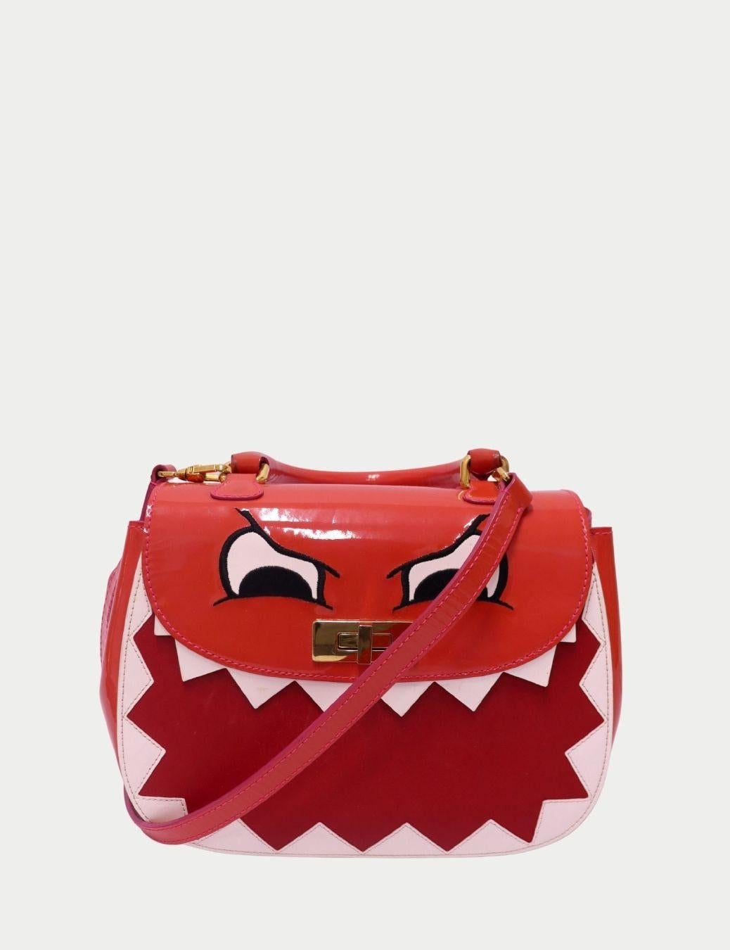 Moschino Cheap & Chic “Dino” Red Patent Leather Bag

A rare collectible from Moschino’s playful Cheap & Chic line, this “Dino” Red Patent Leather Bag embodies the brand’s signature sense of humor and bold Italian creativity.


Designed with quirky