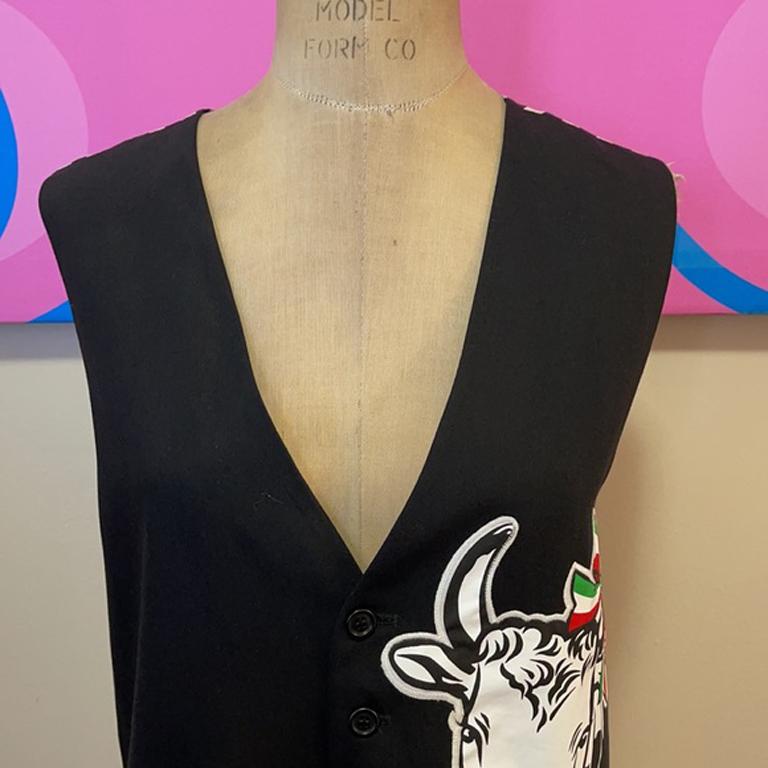 Moschino cheap chic men's cow vest

Be retro cool wearing this charming vest by Moschino Cheap and Chic line! This men's vest is perfect with dark black wool gabardine pants and a collarless shirt. 
Size 42.

Across chest - 21 inches
Across waist -