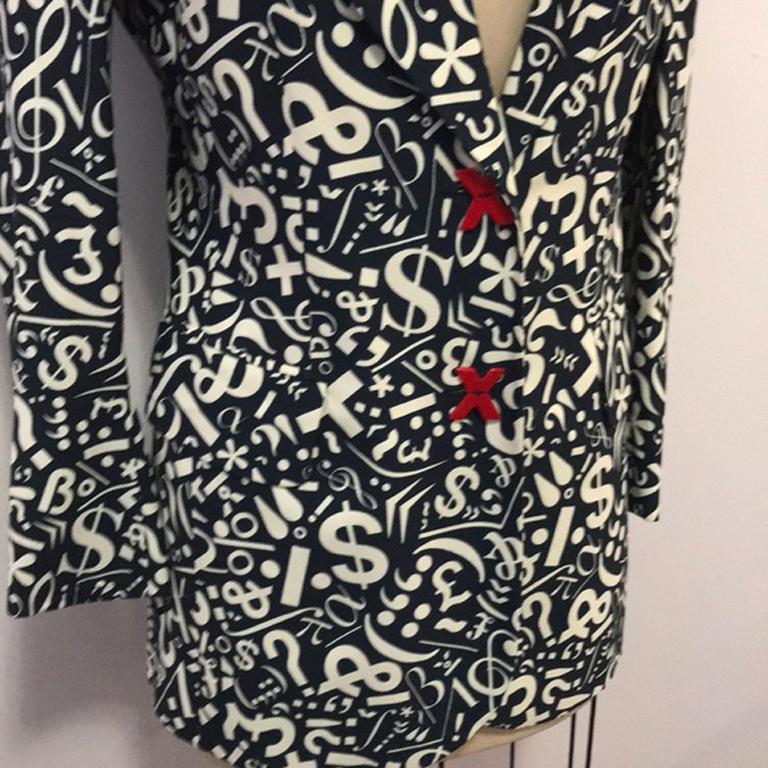 Moschino cheap chic music note love blazer

Vintage Moschino at its best with this black and ivory blazer with music nite and question marks and X and O all over. Treble clef. Pair with black skinny pants and ankle boots for a great look. 
Size 4.