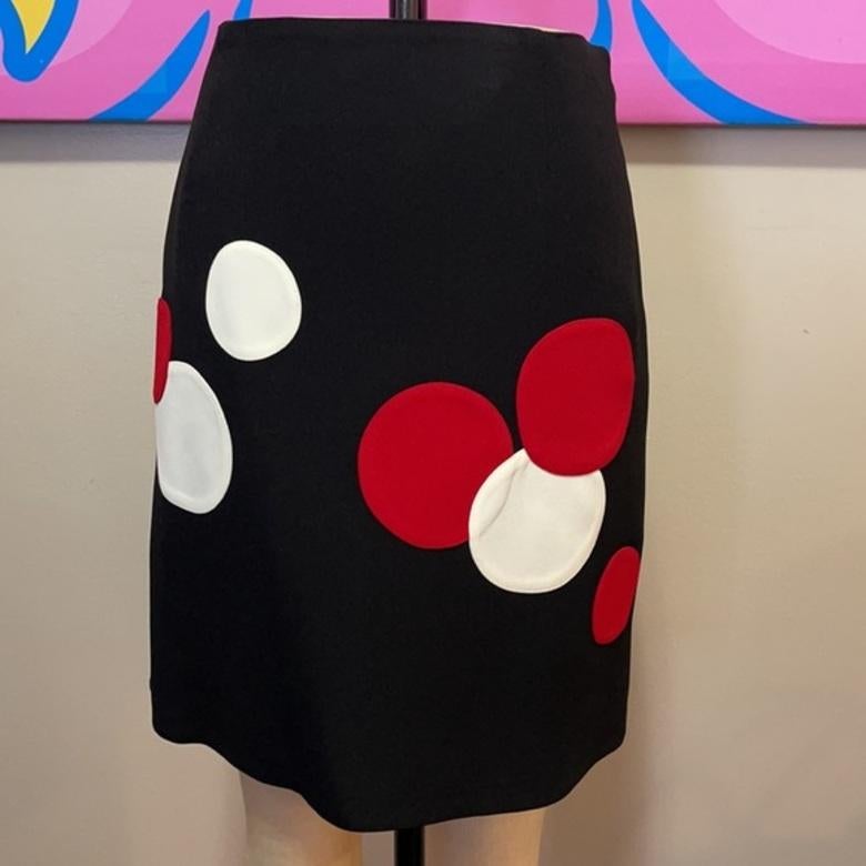 Moschino cheap chic polka dot skirt

This iconic short skirt by Moschino was made famous by The Nanny TV show worn by Fran Drescher with a matching Jacket. Pair with a classic black turtleneck sweater for a finished look. 
No size tag

Across waist