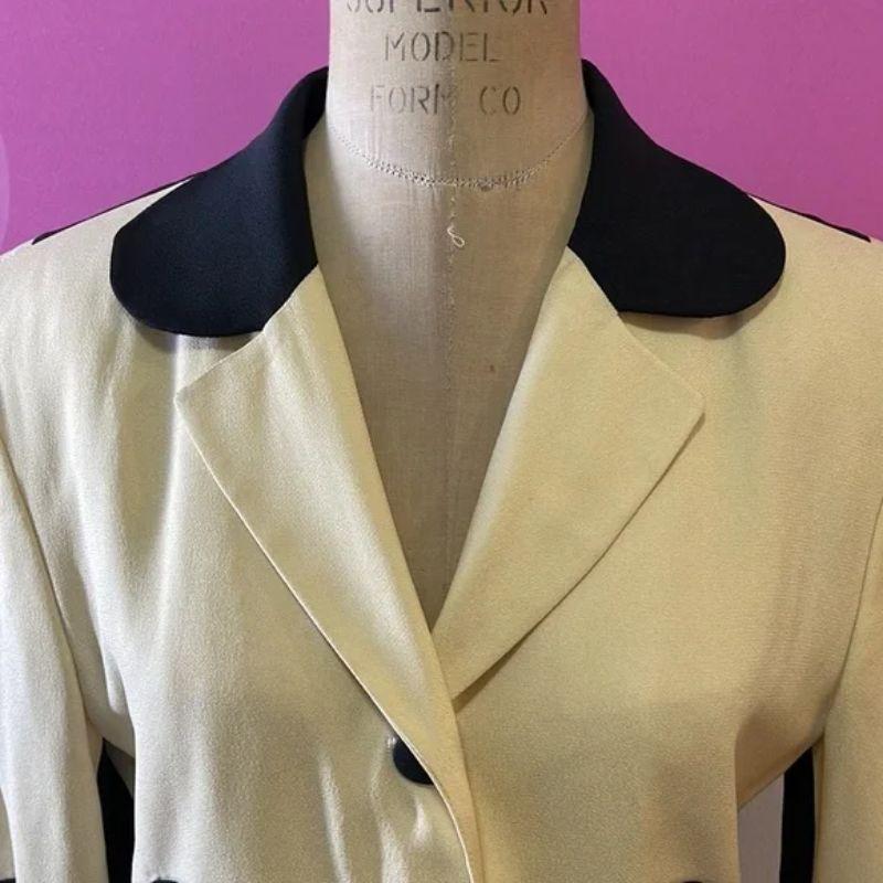 Moschino cheap chic puzzle piece ivory black blazer

Be retro cool wearing this iconic puzzle piece blazer by Moschino. Pair with black pants for a finished look.

Size 6
Across chest - 18 1/2 in.
Across waist - 15 in.
Shoulder to hem - 28