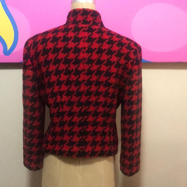 Moschino cheap chic red black houndstooth jacket

Vintage iconic Moschino jacket with two velvet question marks in the front. Perfect for Fall with black skinny pants and boots or a traditional pencil skirt. Brand runs small
Size 8
Across chest - 19