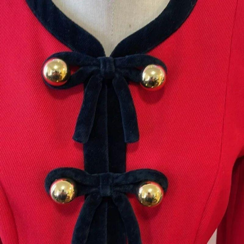 Moschino cheap chic red wool black velvet trim jacket

Be retro glam wearing this vintage jacket by Moschino Cheap and Chic! Red wool and black velvet trim with bright gold metal ball buttons add glamour! Pair with black skinny pants and boots or a