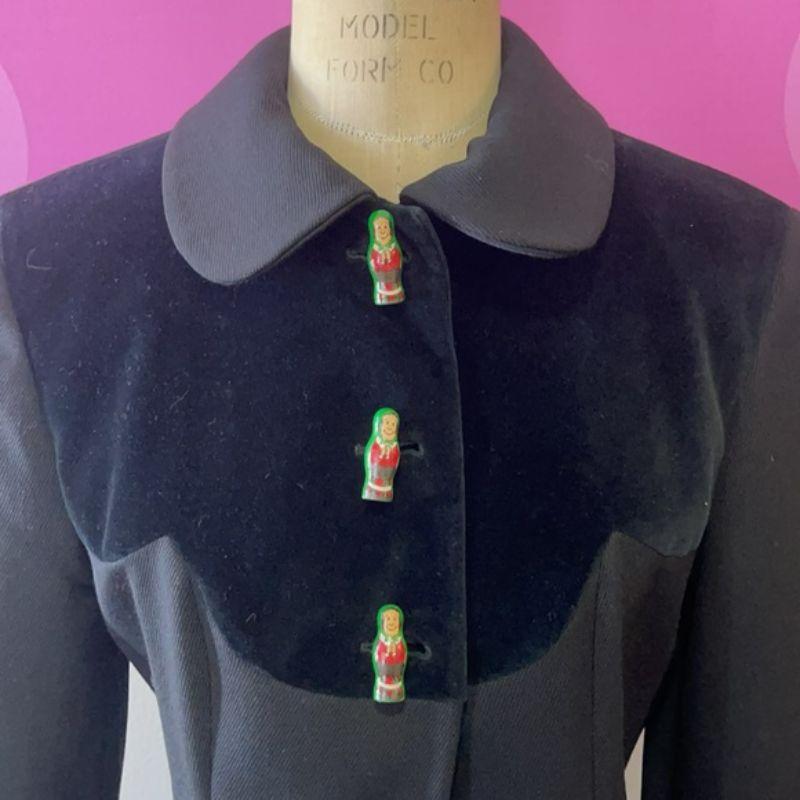 Moschino cheap chic russian nesting dolls blazer

Vintage perfection! this black wool and velvet trim blazer with tiny wood buttons that look like Russian Nesting dolls is a stand out. Pair this with black wool gabardine pants and ankle boots for a