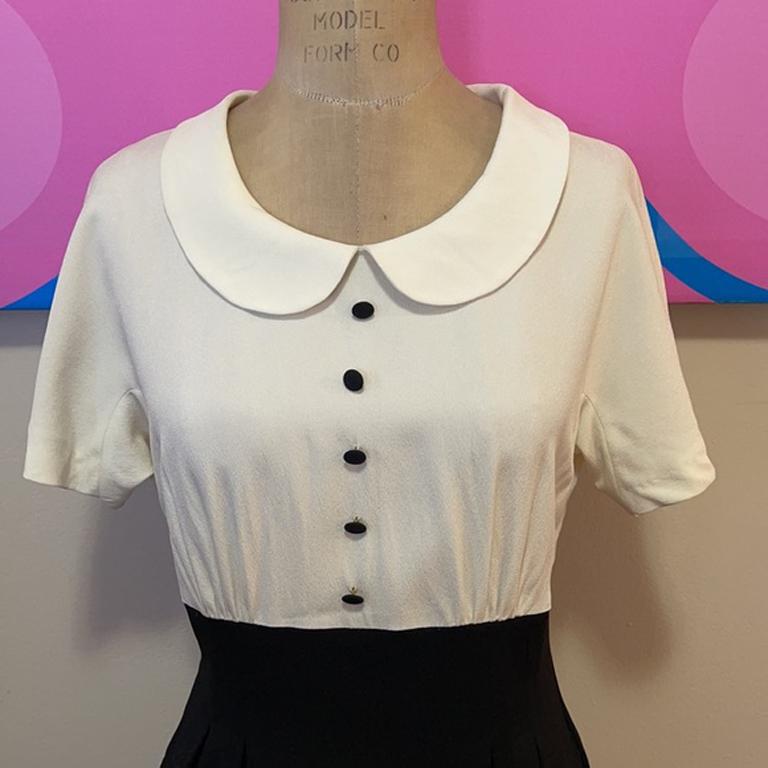 Moschino cheap chic tuxedo dress

Be retro fashionable wearing this vintage tuxedo style dress by Moschino Cheap and Chic! Just add nude or black heels.
The zipper has been replaced and is not original to the garment. 
Size 10

Across chest - 18.5
