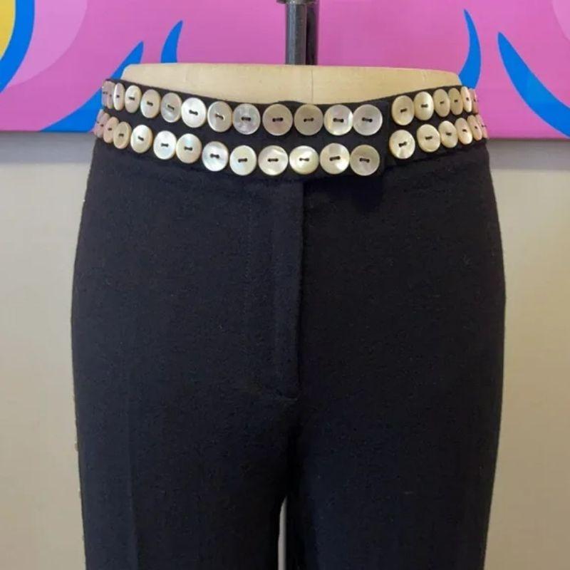 Moschino cheap chip black tuxedo button pants

Moschino Cheap Chic makes special occasion dressing shine wearing these unique black wool crepe pants with pearlized buttons around the waist, hem and down the sides. Pair with ivory silk blouse for a