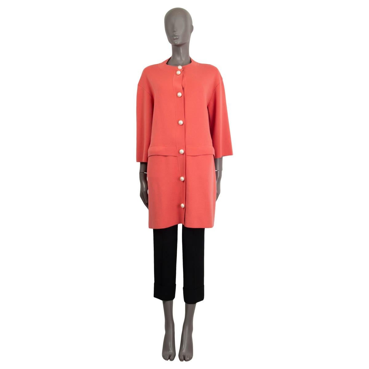 100% authentic Moschino 'Cheap & Chic' 3/4 sleeves knit coat in pink virgin wool (53%) and cotton (47%). Comes with two hidden pockets on the front. Opens with seven push pearl embellished push buttons. Unlined. Has been worn and is in excellent