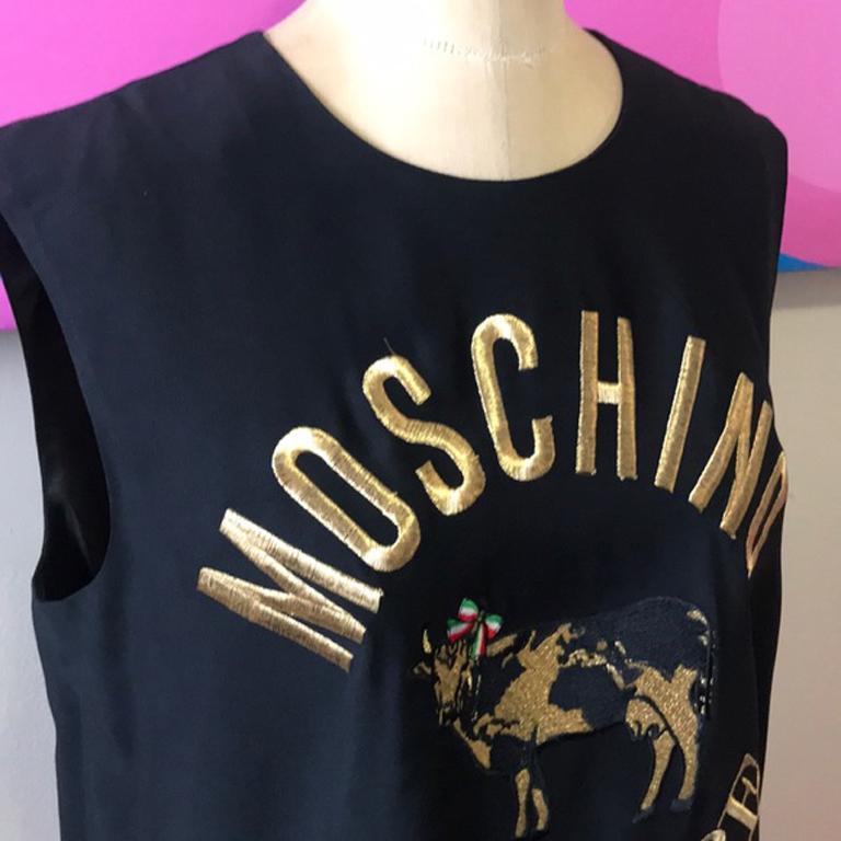 Moschino couture black cow shirt embroidered

Unique embroidered top by Moschino Couture  with iconic cow! Gold thread is nice offset to black top. Pair with black pencil pants for a finished look.
Size 12
Ask for measurements to endure