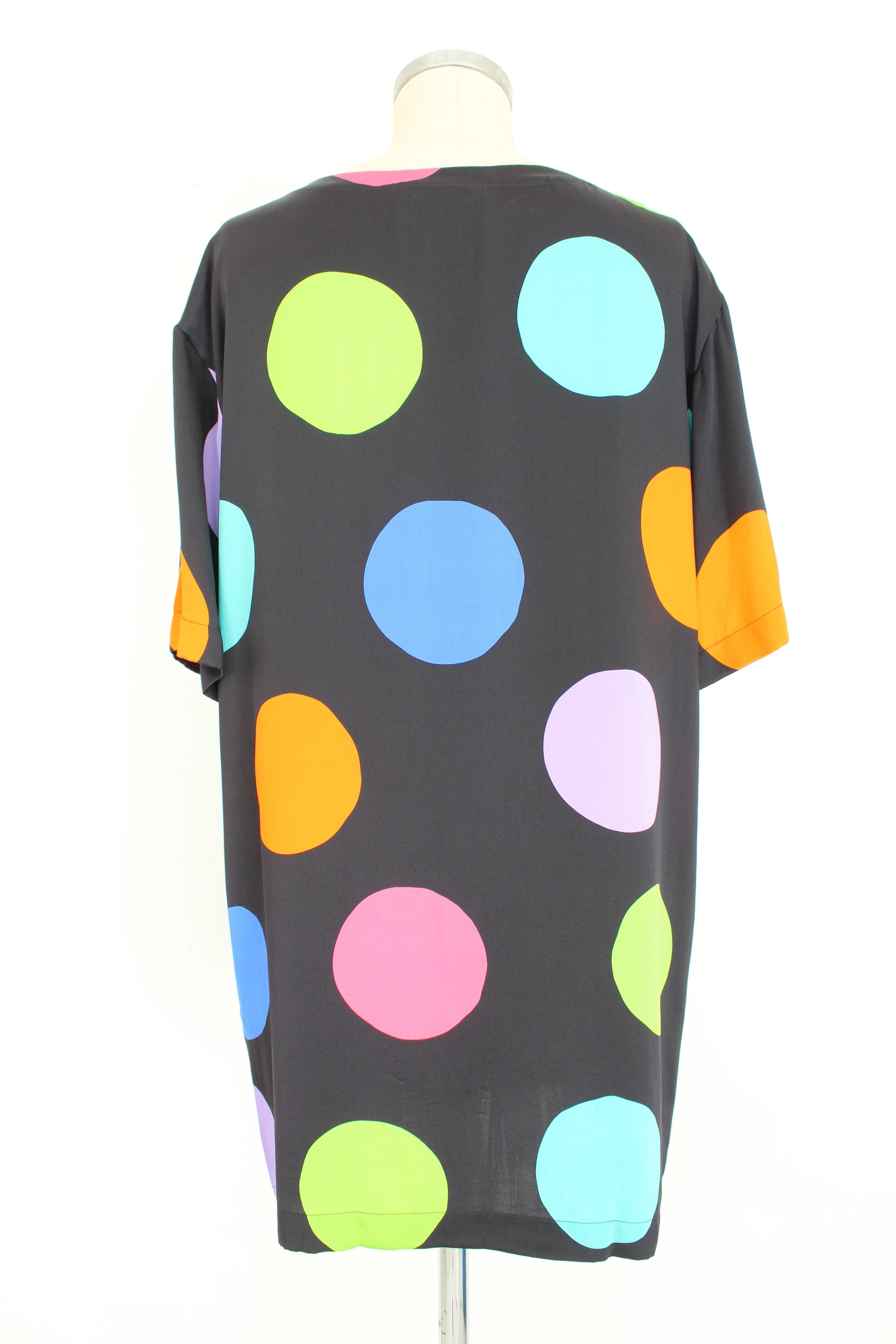 Moschino Couture 2000s vintage woman dress. Sack model dress, knee length. Black color with colored polka dots. 100% silk fabric. Made in Italy.

Condition: Excellent

Item used few times, it remains in its excellent condition. There are no visible