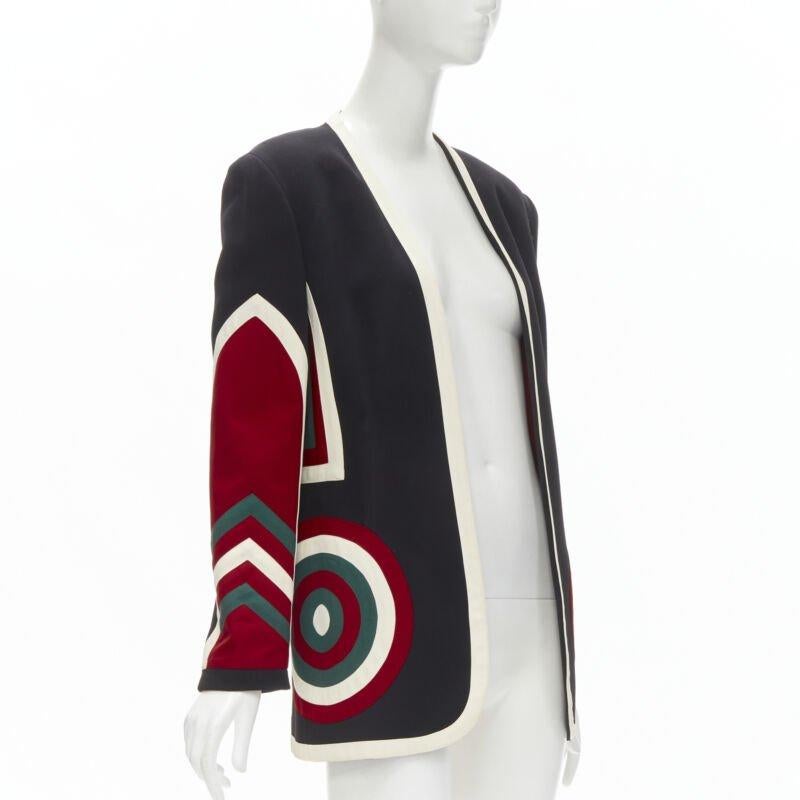 MOSCHINO COUTURE! black red creoe Star Bullseye geometric blazer IT42 L
Reference: BMPA/A00195
Brand: Moschino
Designer: Jeremy Scott
Material: Acetate, Rayon
Color: Black, Red
Pattern: Solid
Lining:  Acetate
Extra Details: Dartboard circle pockets