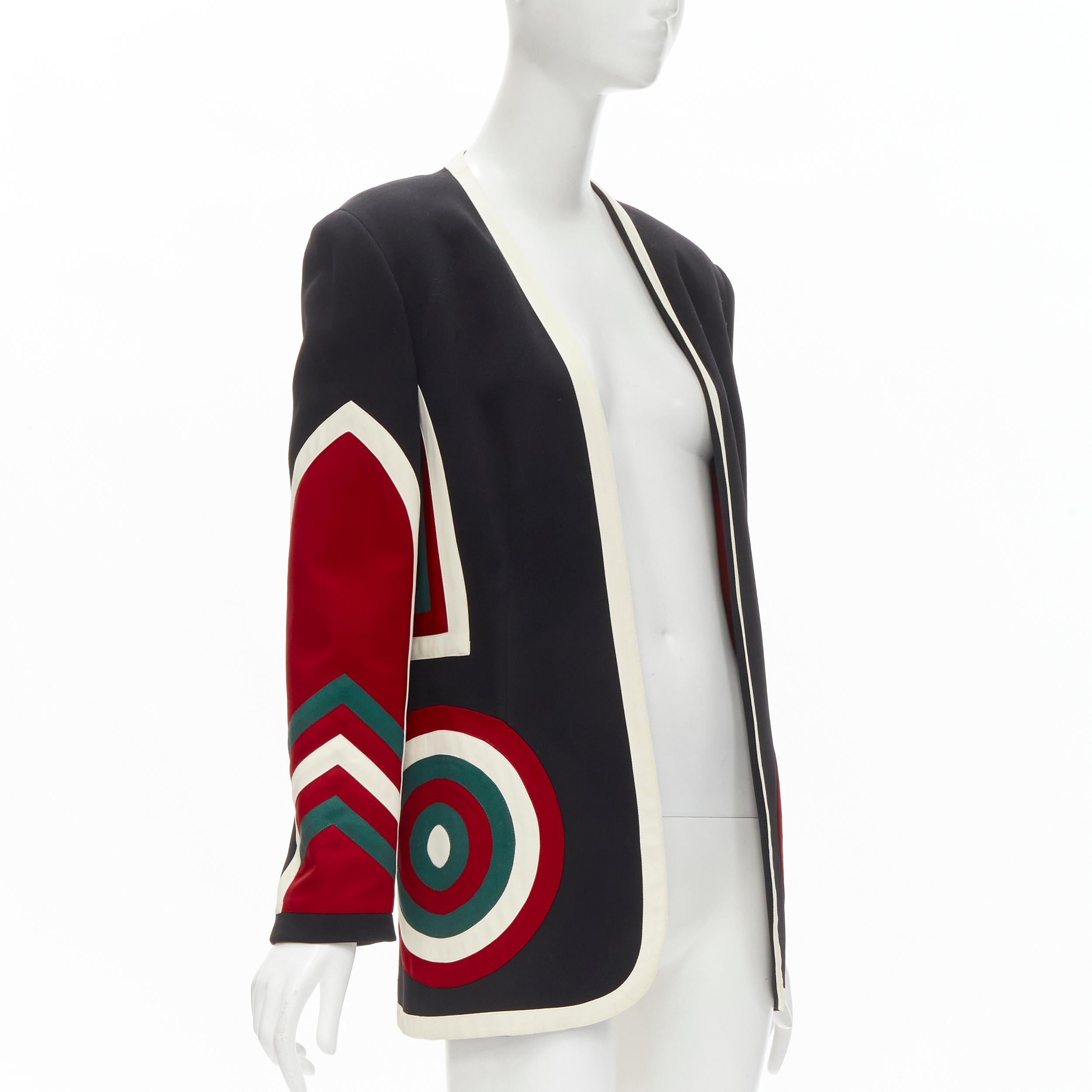 MOSCHINO COUTURE! black red creoe Star Bullseye geometric blazer IT42 L
Brand: Moschino
Designer: Jeremy Scott
Material: Acetate
Color: Black
Pattern: Solid
Extra Detail: Dartboard circle pockets at front. Collarless. Geometric pattern on sleeves.