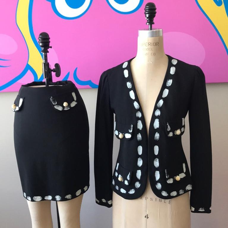 Moschino couture black vintage hand print suit

This iconic vintage hand print suit is documented in the MOSCHINO 10 year book. Museum Quality.  Same suit was featured in the Mint Museum Exhibit
Brand runs small.
Size 4
Jacket
Across chest - 16.5