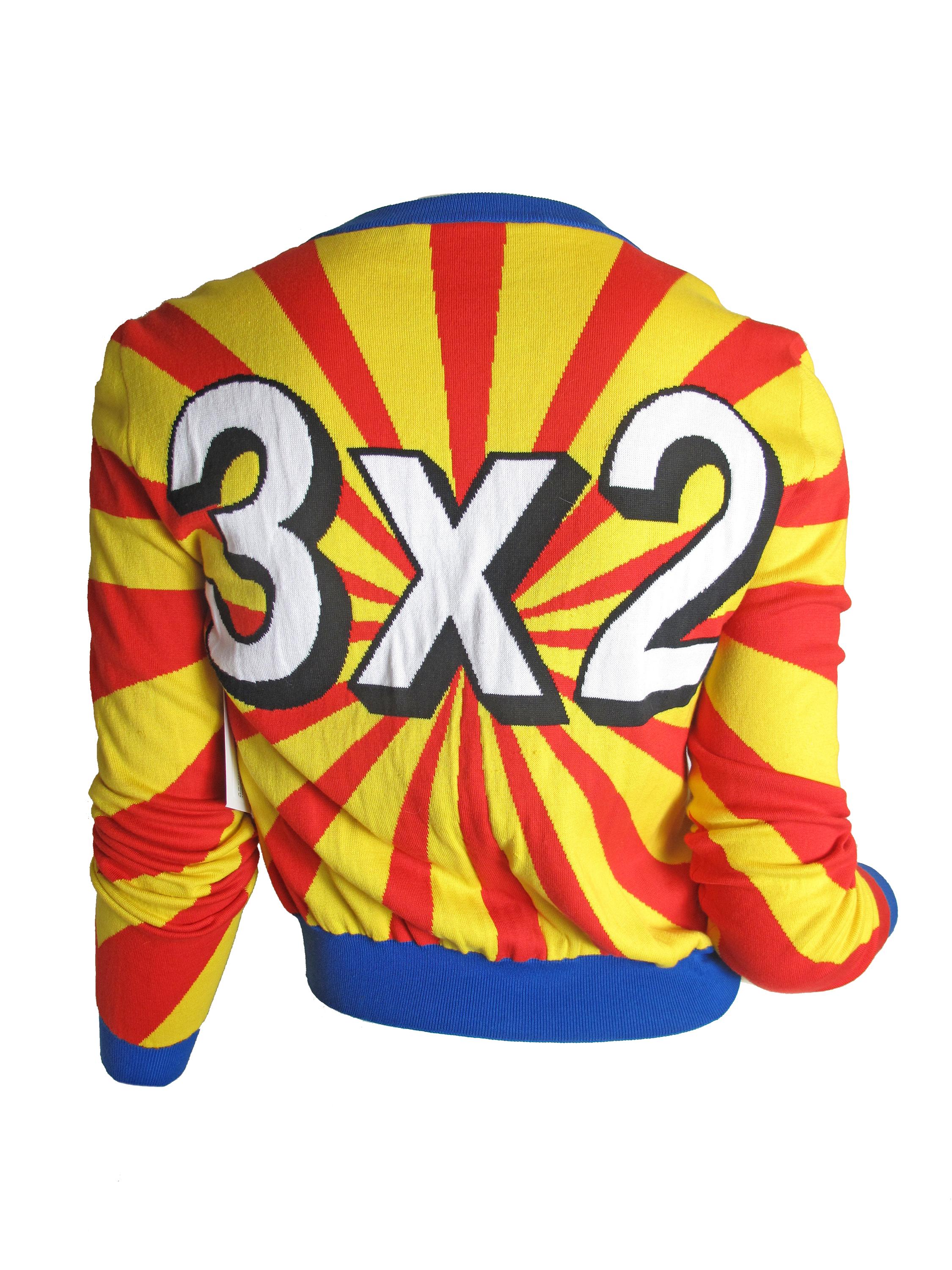 Moschino Couture Bullseye cardigan sweater.  Red, yellow, blue and white with 3 x 2 on back.  Condition: Excellent. Size Small

 