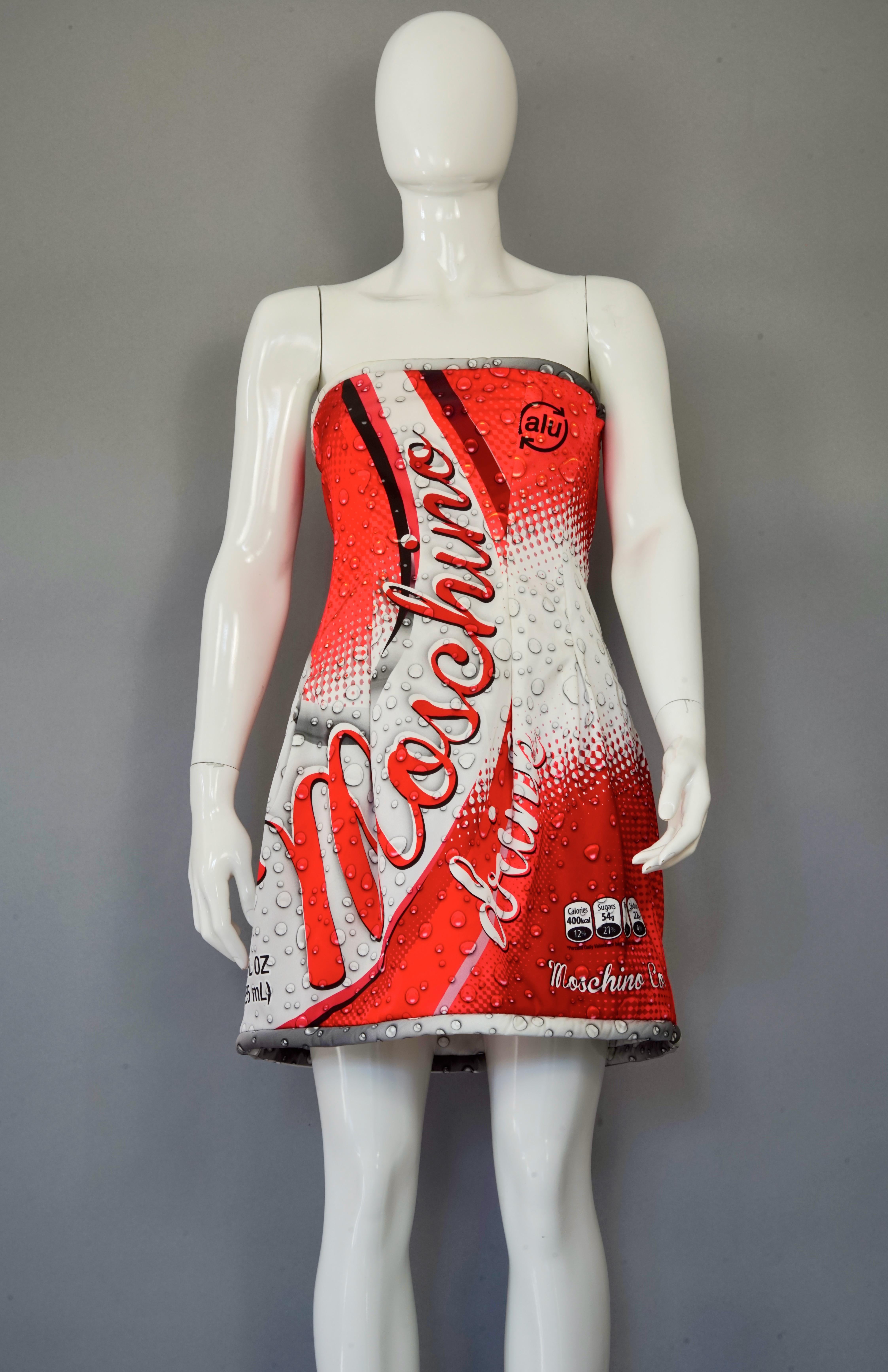 MOSCHINO COUTURE Cola Bustier Dress

Measurements taken laid flat, please double bust, waist and hips:
Bust: 16.53 inches (42 cm)
Waist: 14.96 inches (38 cm)
Hips: 19.68 inches (50 cm)
Length: 22.04 inches (56 cm) 

Features:
- 100% Authentic
