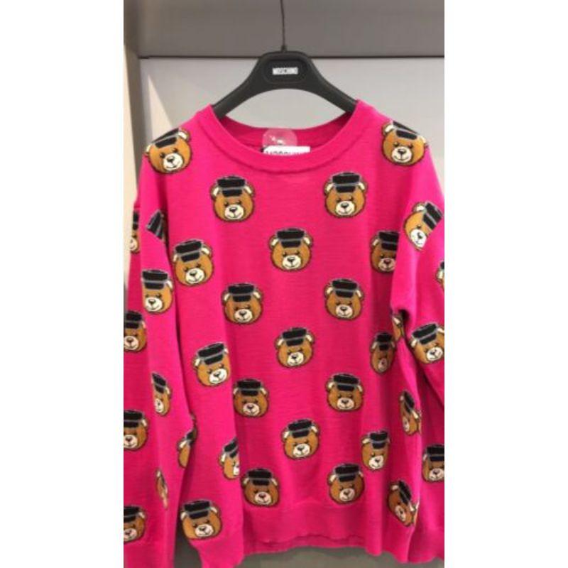 Moschino Couture Jeremy Scott All Over Teddy Bears Policeman Pink Sweater 36 IT

Additional Information:
Material: 100% Cotton    
Color: Black/Brown/Pink        
Pattern: AW16 Teddy Bear Project        
Style: Pullover Sweater
Size: 36 IT
100%