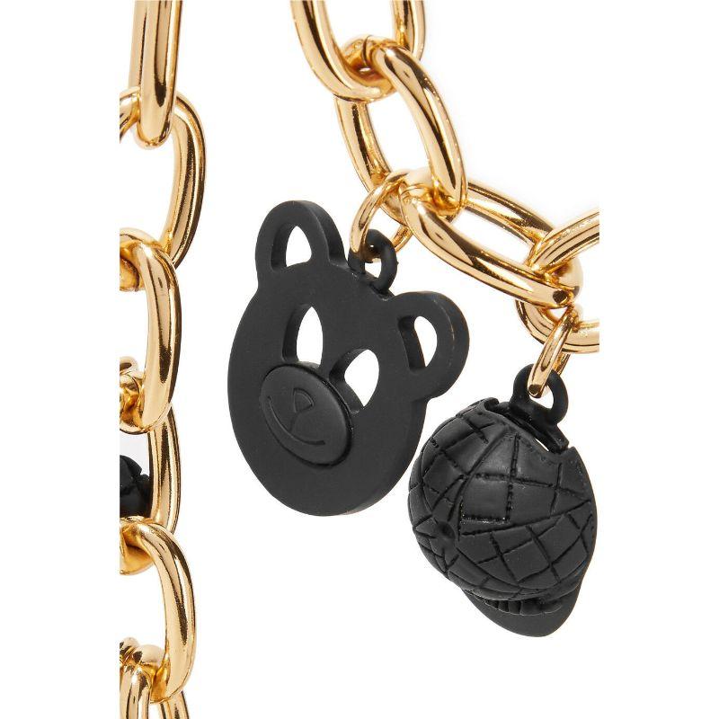 Moschino Couture Jeremy Scott Gold Black Metal Necklace Teddy Peace Smiley

Additional Information:
Material: Metal
Color: Gold/Black
Pattern: Smiley Face/Bag/Pumps/Pouch/Heart/Teddy/Cap    
Style: Casual
100% Authentic!!!
Condition: Brand new with