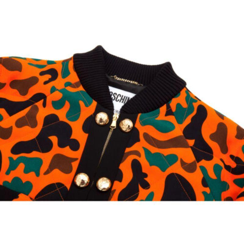 Moschino Couture Jeremy Scott Orange Black Brown Green Camouflage Bomber Jacket

Additional Information:
Material: 100% polyester. Lining material: 100% Rayon     
Color: Multi-Color    
Pattern: Camo
Style: Jacket
Size: 42 IT
100%