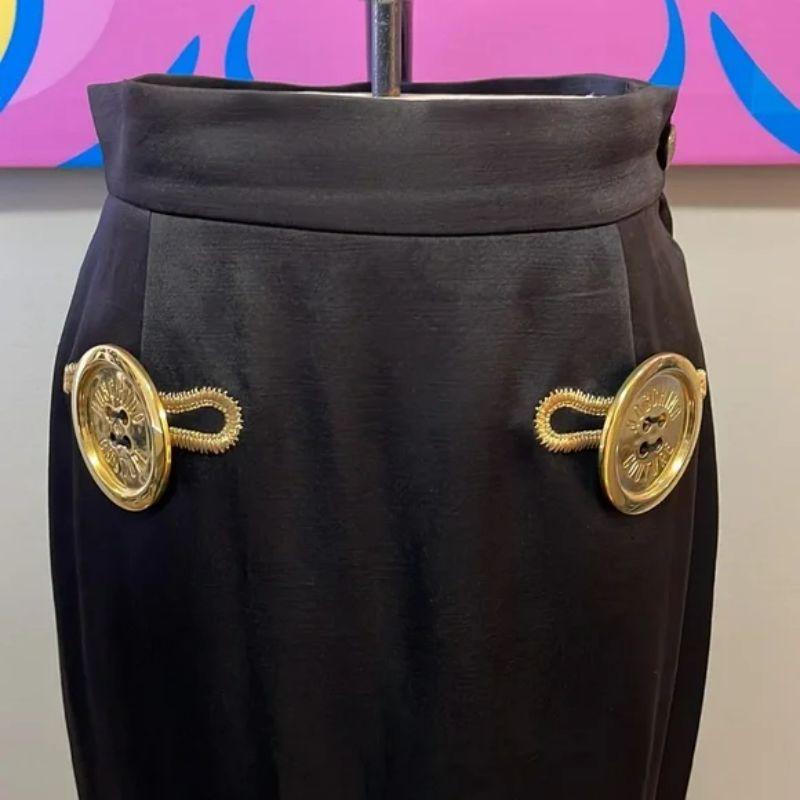 Moschino couture off blacka satin pencil skirt buttons

Be retro glam in this vintage Moschino Couture pencil skirt. THe color is an unusual off-black satin, almost looks brownish and is not a true black. Gold buttons. Pair with classic turtleneck