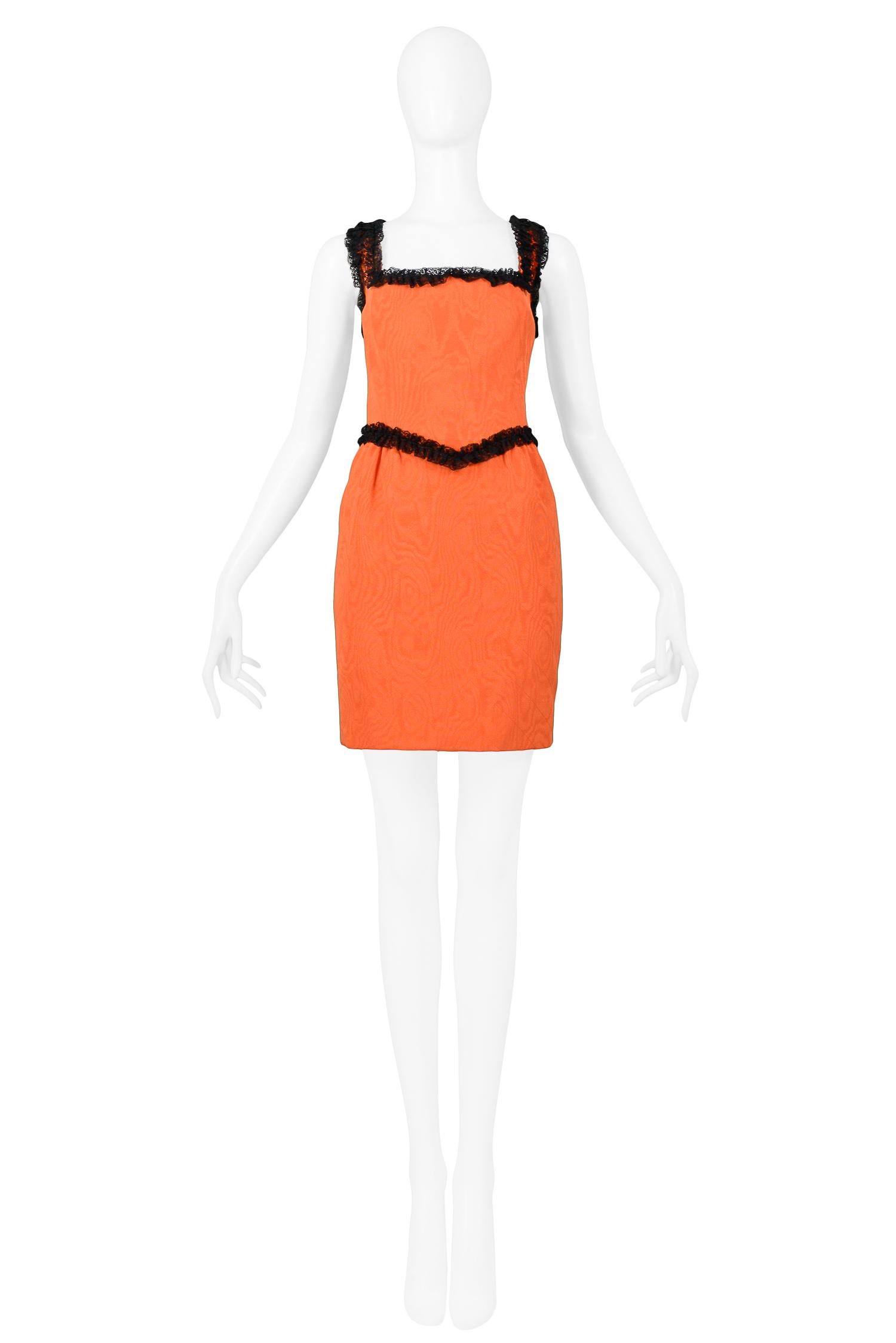 Resurrection Vintage is excited to offer a vintage orange Moschino Couture by Franco Moschino cotton rayon blend mini dress: featuring moire faille fabric, black lace trim, and center back zipper.

Moschino
Size 40
51% Cotton, 49% Rayon
Excellent