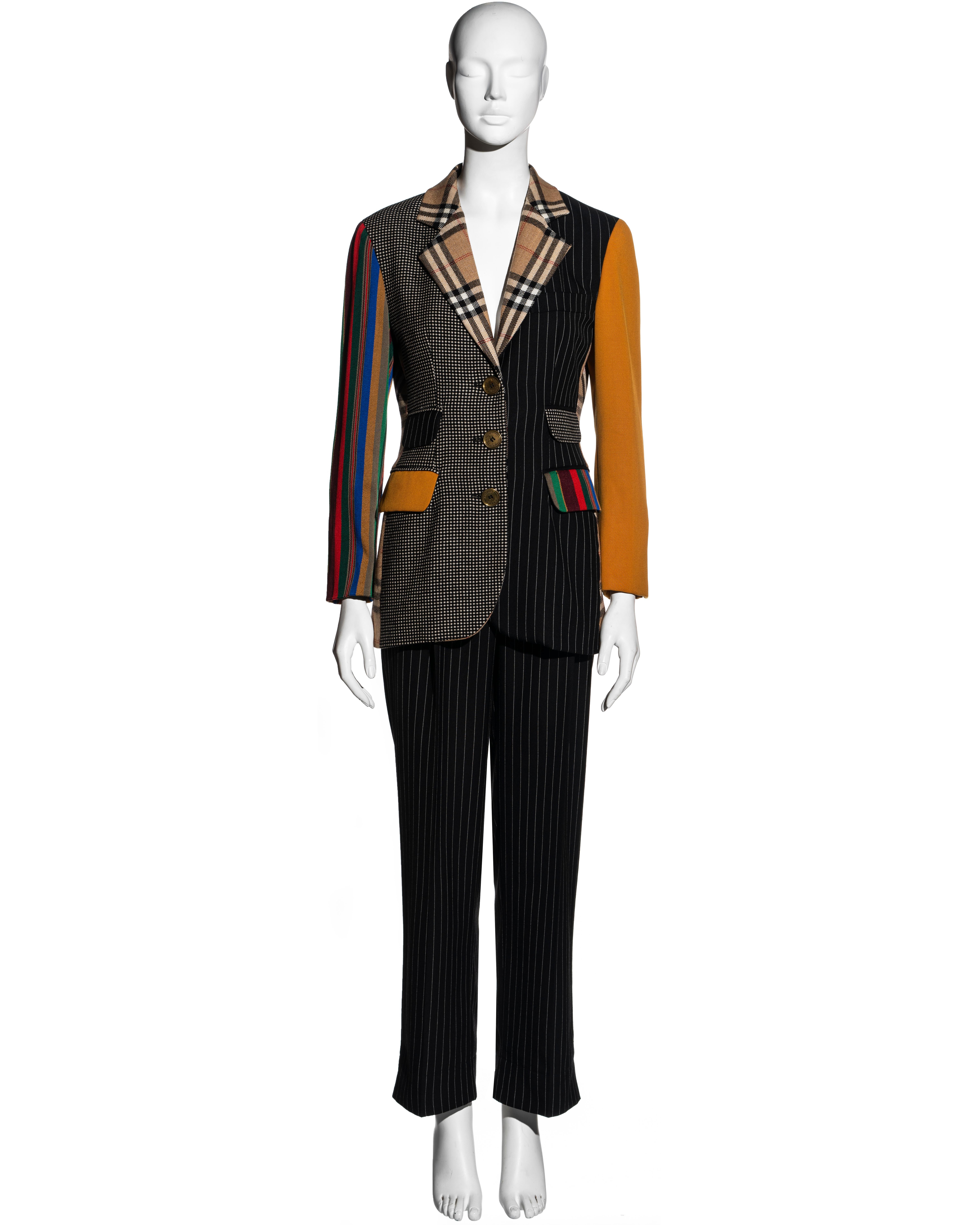 ▪ Moschino Couture wool pantsuit 
▪ Made from a patchwork of various fabrics including a Burberry Nova check inspired wool
▪ Singled breasted blazer jacket with notched lapel and four front flap pockets 
▪ Large 'Moschino' etched buttons 
▪