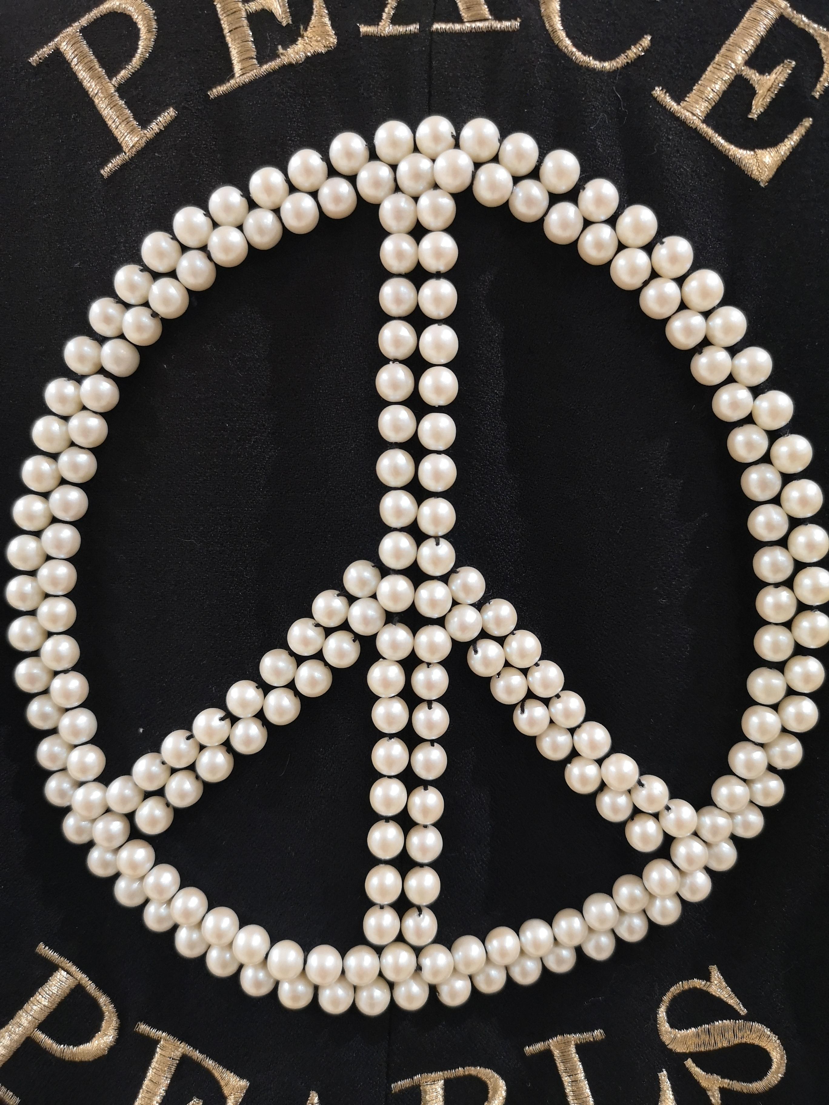 Black Moschino Couture Peace and Pearls black jacket 