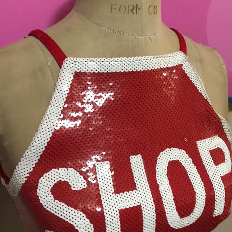 Moschino couture red shop stop sign top

Unique crop top for a fun night out ! Wear under a blazer or along with white skinny jeans. There is stretch to this fabric. 
Size 4

Across chest - 14.5 in.
Across bottom - 13.5 in.
Top of shoulder to hem -