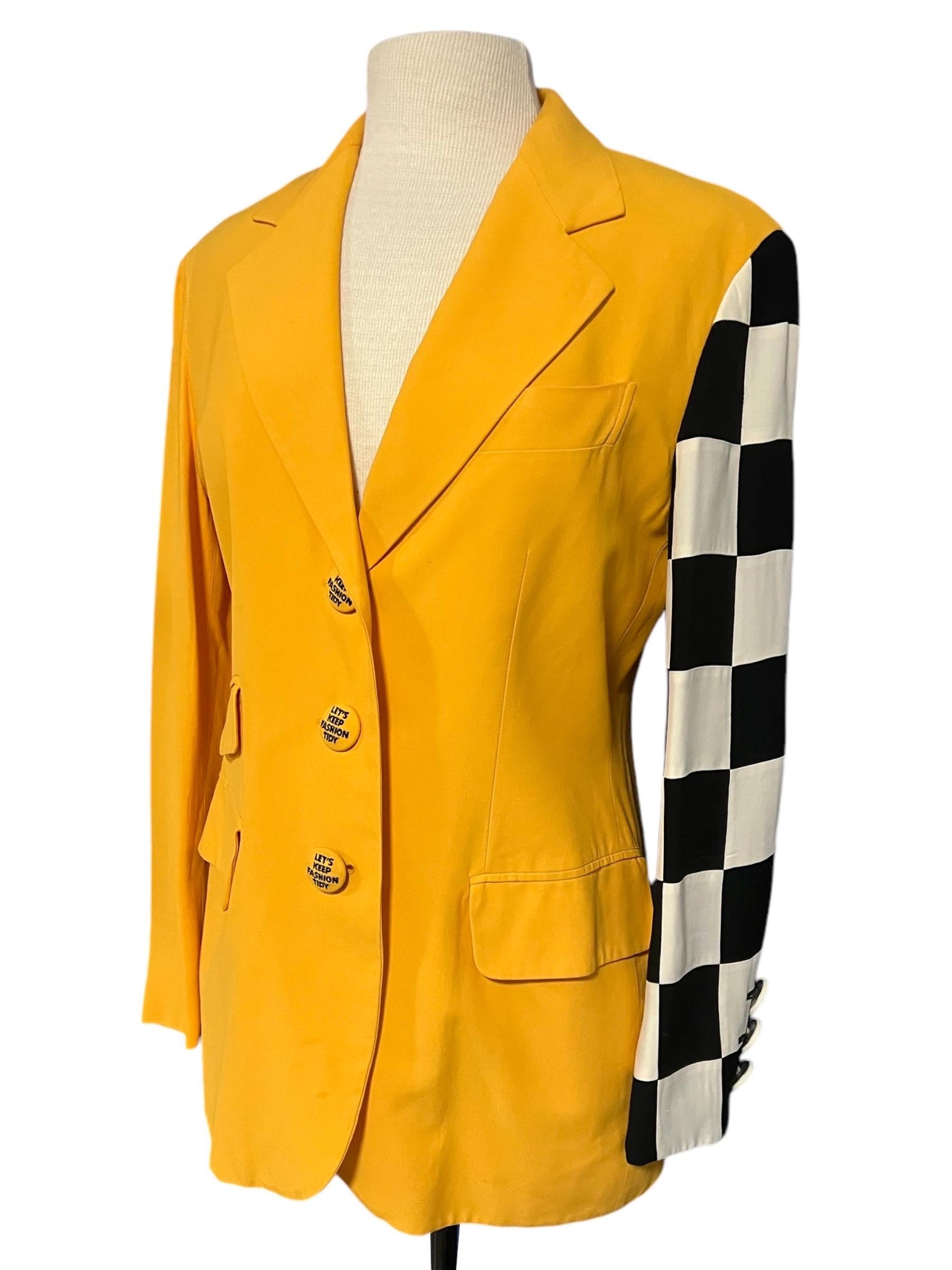 Moschino Couture vintage blazer from the 1990’s. Bright yellow blazer featuring a checkerboard sleeve and whimsical buttons that say “Let’s keep fashion tidy”

Size: 10

Condition: Excellent condition