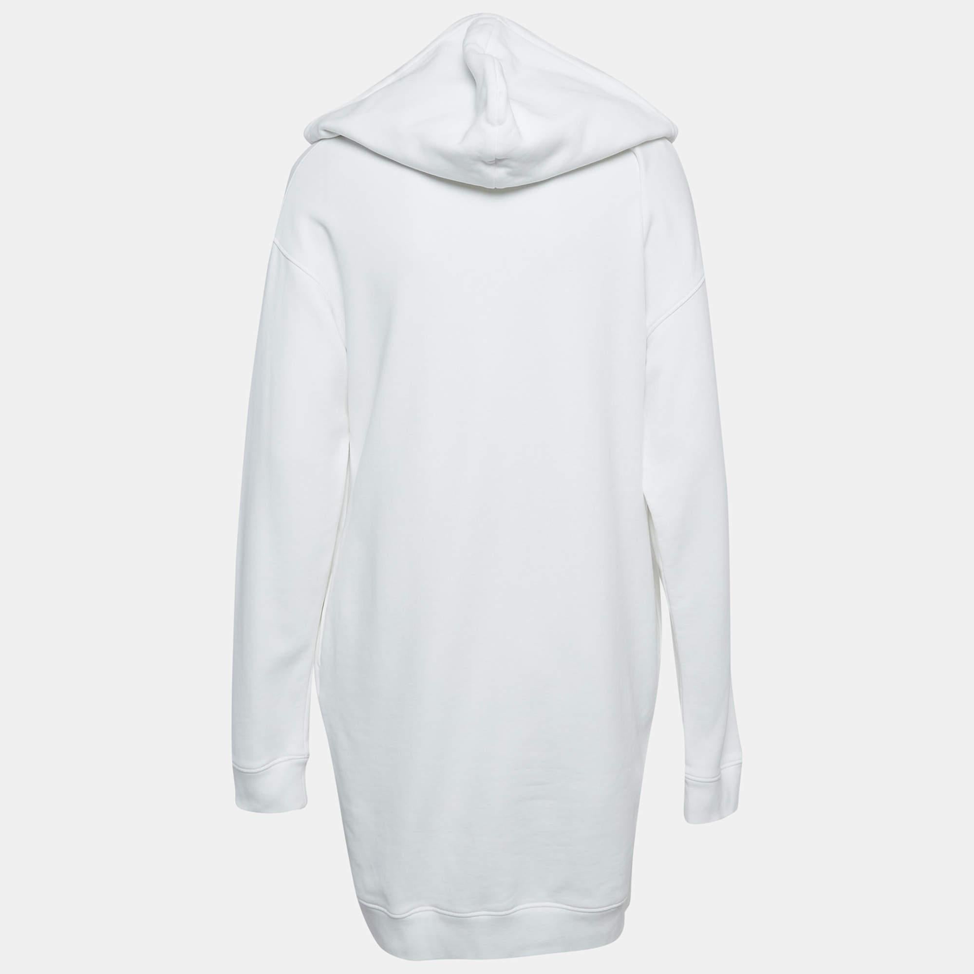 Effortlessly made into a chic design this Moschino Couture hoodie dress is easy to wear and easy to accessorize. Tailored beautifully the dress is sure to remain a favorite season after season.